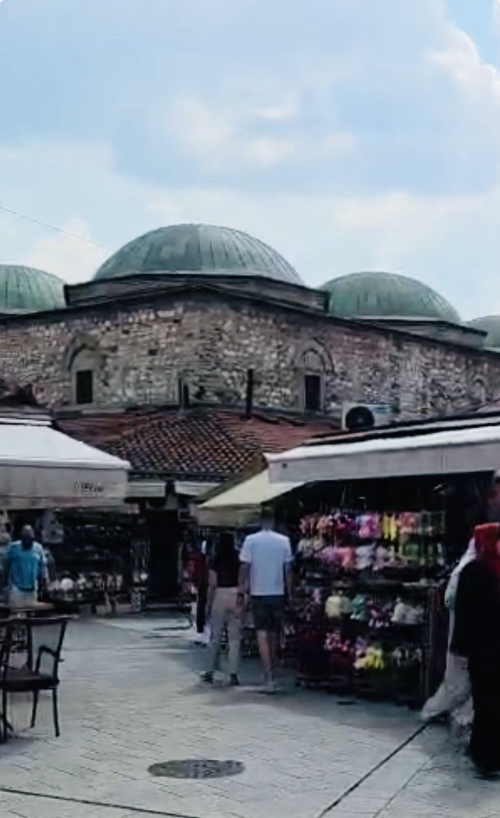 Market stalls and a domed Ottoman bezistan in Sarajevo's Baščaršija bazaar
