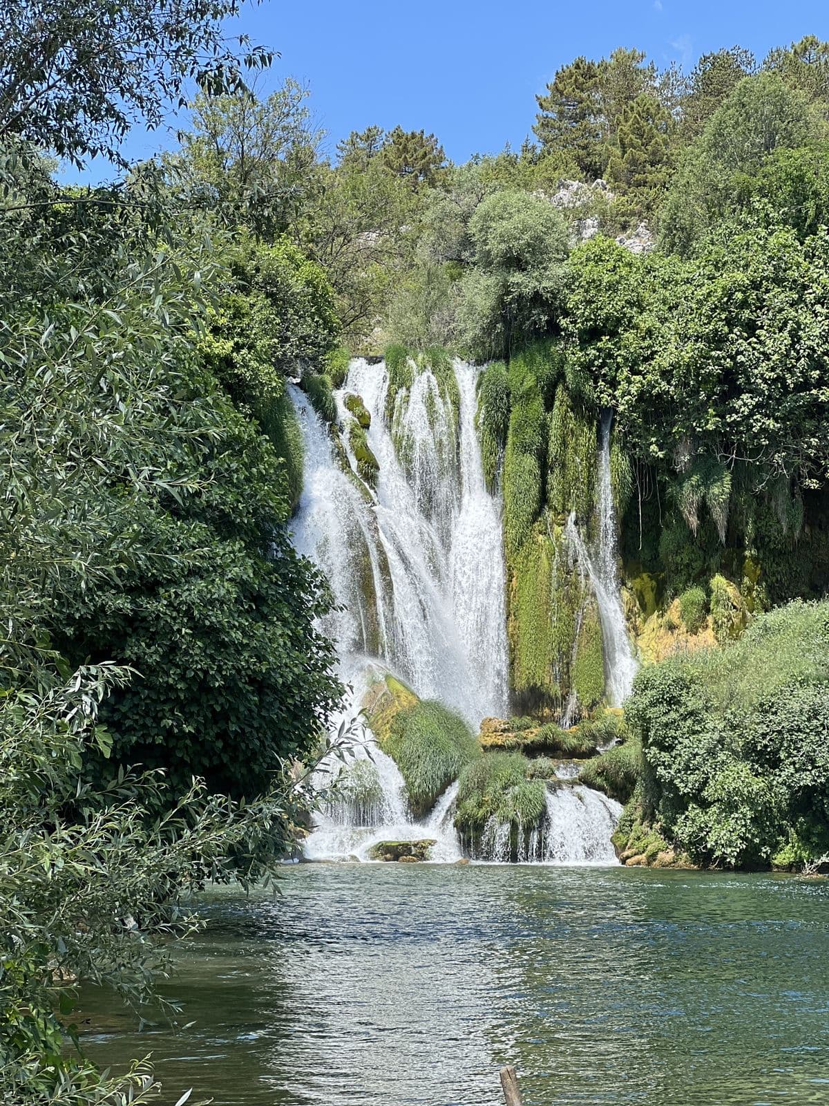 Kravice waterfalls cascading into an emerald pool in Herzegovina
